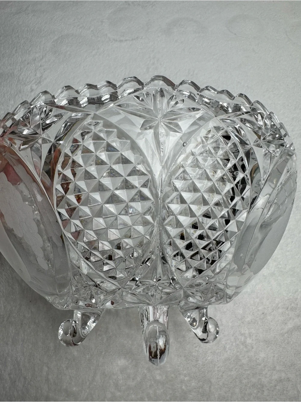 This vintage crystal cut and pressed pear and grape etched footed bowl 8.5”